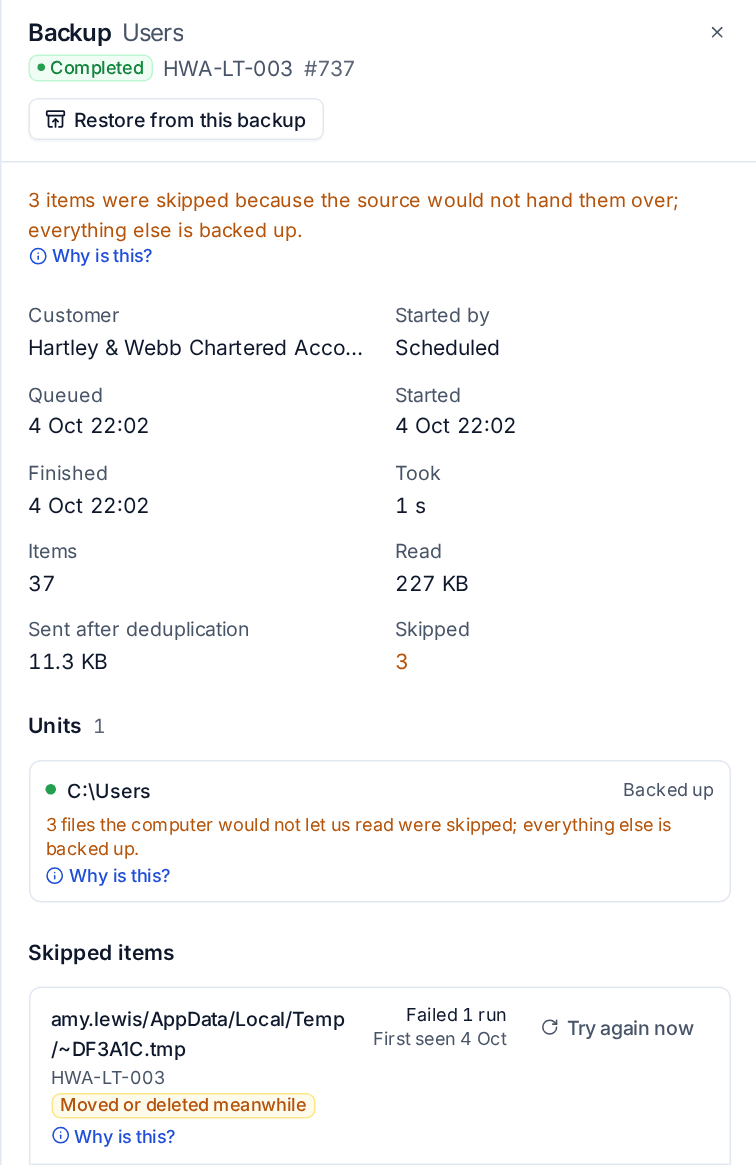 A backup that completed with three skipped items, each with its reason